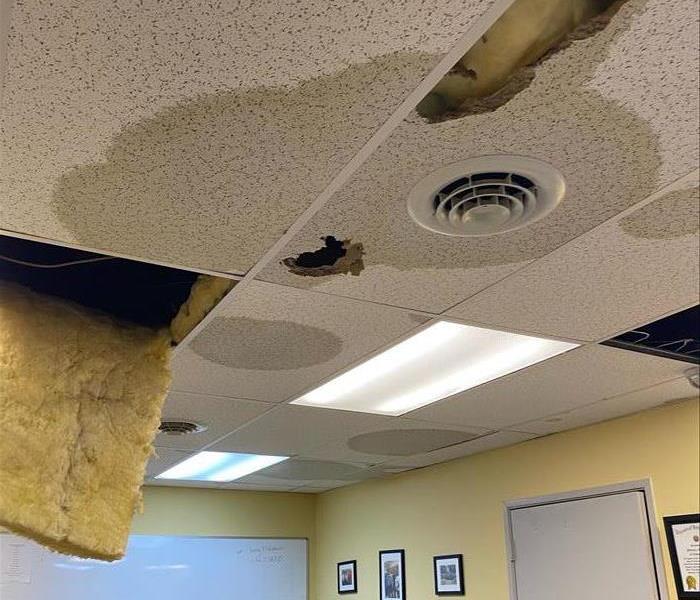 Tiles and insulation falling from the ceiling due to water a water loss