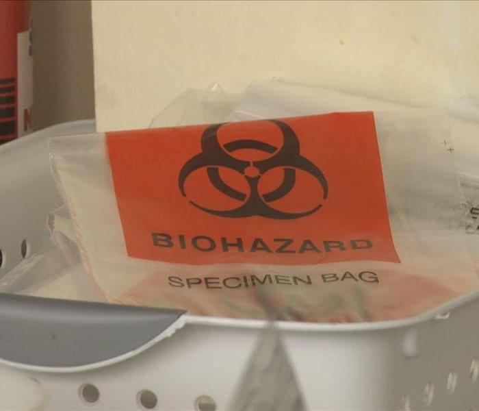 biohazard specimen bag inside of a basket