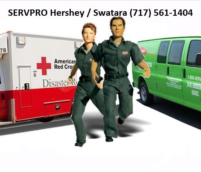 male and female action figures with ambulance and SERVPRO van behind them